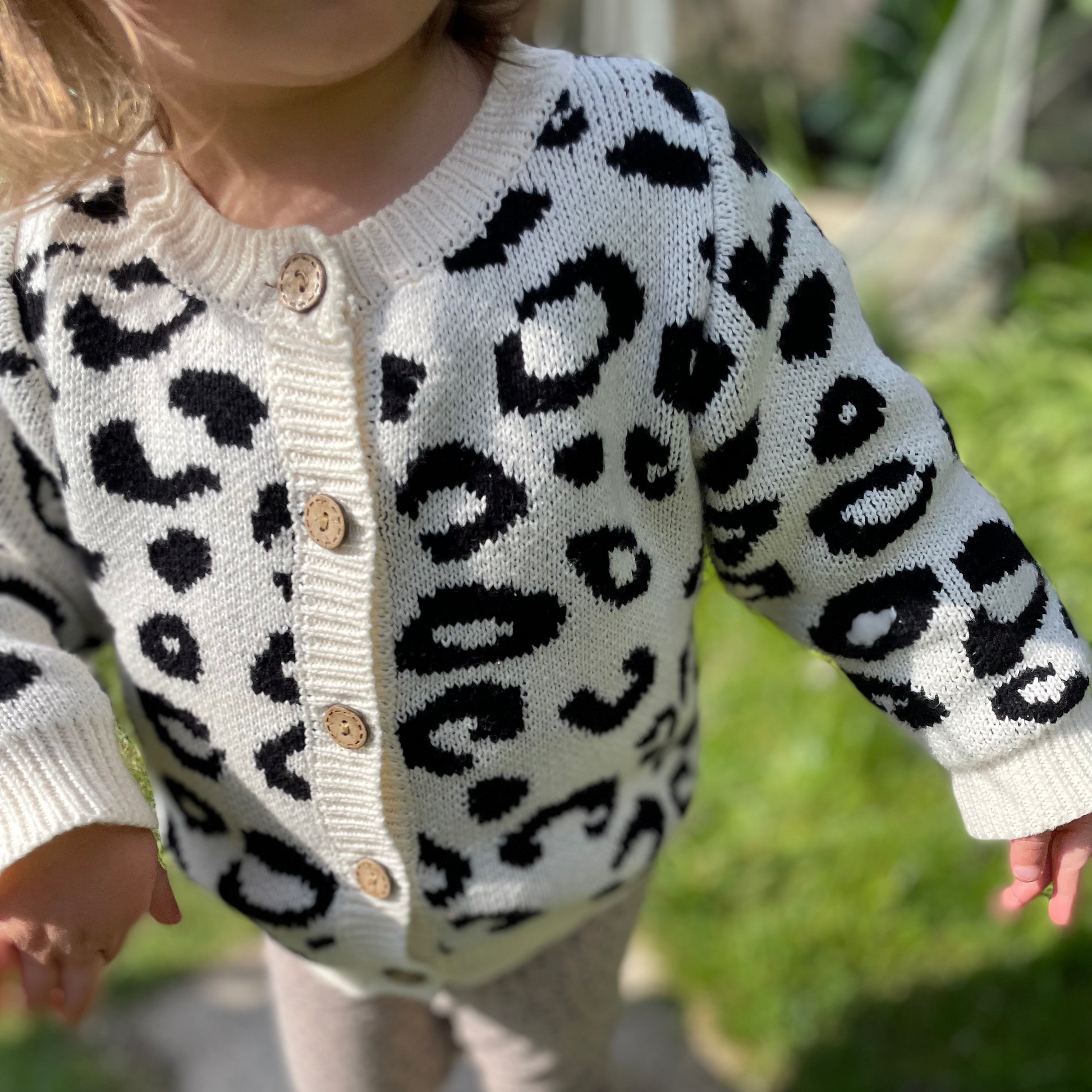 toddler wearing leopard print knitted cardigan