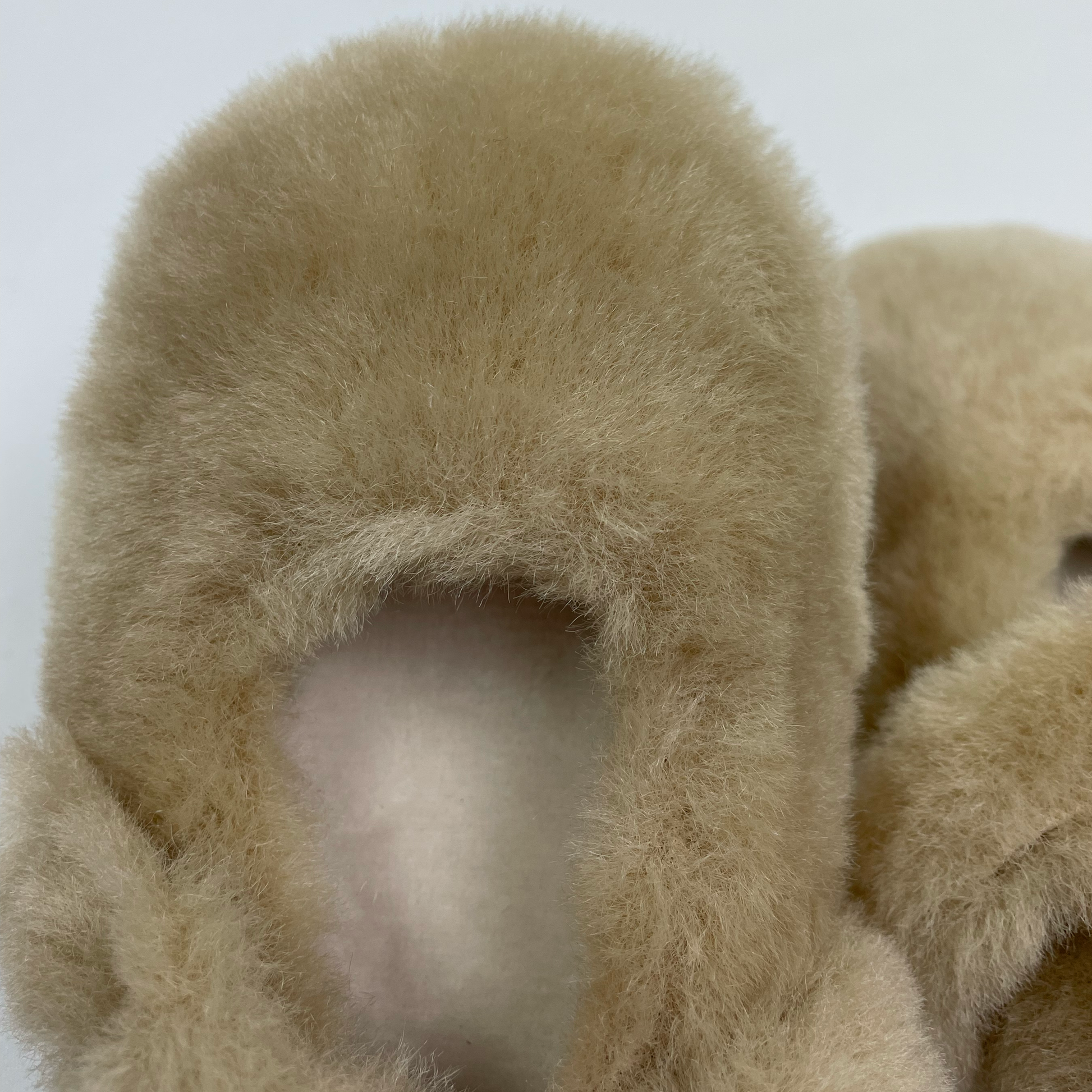 apricot brown beige fluffy baby slippers close up showing cream faux fur lining to keep babies toes warm